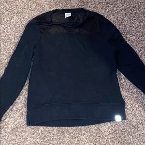 Black long sleeve top with cut’s at the end’s